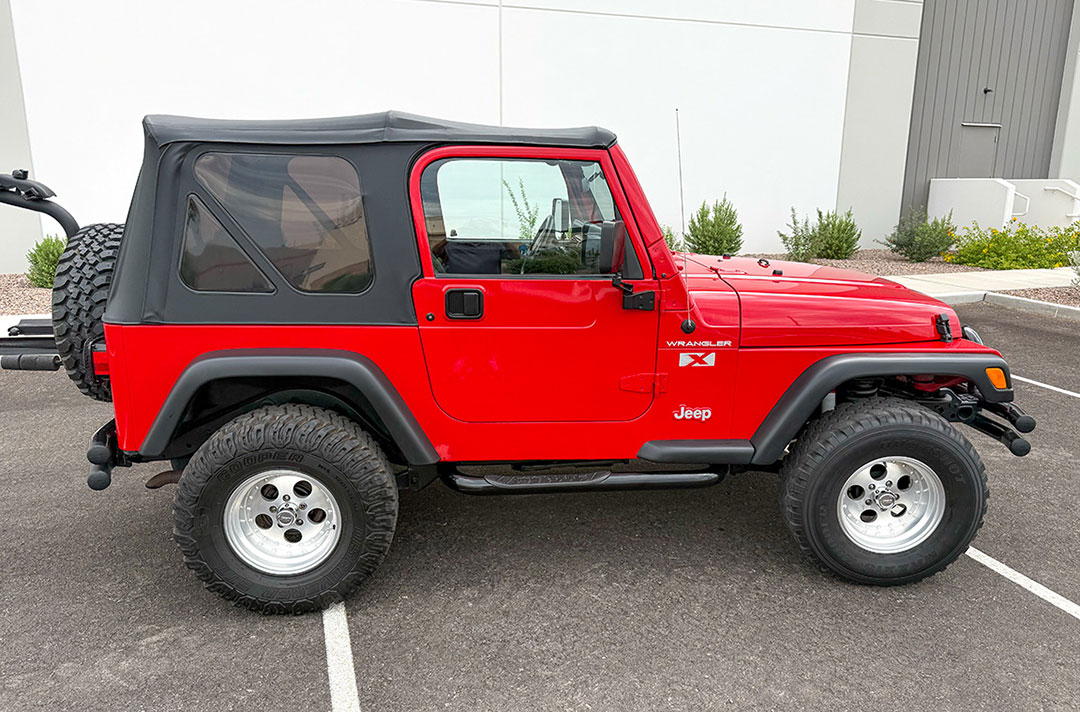 2002 Jeep Wrangler X in red, side view